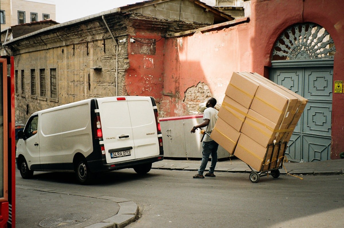 Movers carrying furniture during a local Northwest Arkansas move